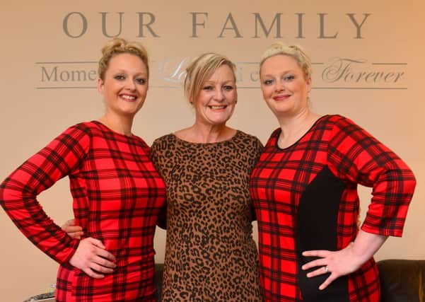SPECIAL BOND Twins Rachael Ellis and Becky Denvers with mum Tania Corcoran. (D547C350)