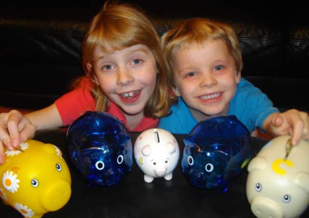 KIND HEARTED Katie and Harry Ashford raided their piggy banks in support of Sam Bottomley.
