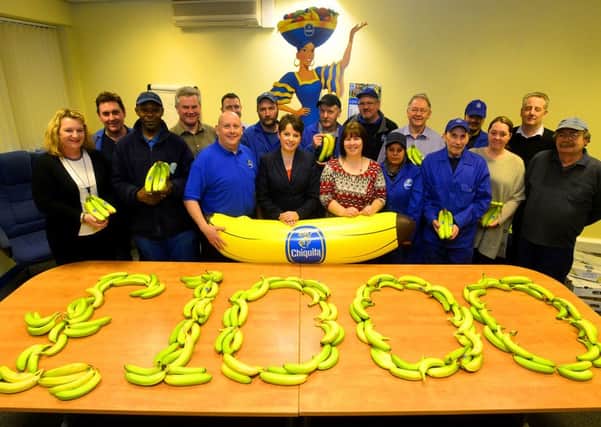 FRUITFUL FUNDRAISING Suzanne Dyda from Hollybank with some of the charitable Chiquita UK staff. (D544A404)