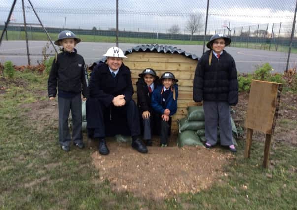 World War Two experet Darren Birchall visited Crossley Fields School in Mirfield.
He is pictured with year 4 pupils Alex Smith, Haleemah Anwar, Ruqaayyah Ileyas and Muhammad Rehan.