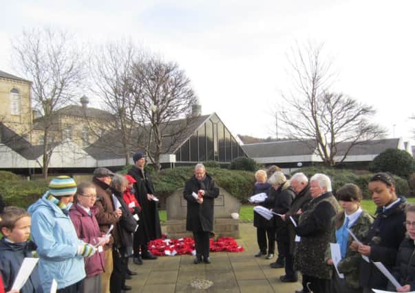 REMEMBERING VICTIMS The Rev Canon Kevin Partington leads a Holocaust Memorial Day service.
