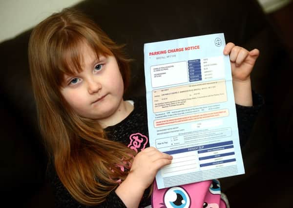 Livvi Eagleton with the parking notice given to her mum.