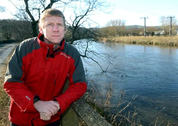 Coun Martyn Bolt, pictured by the River Calder which he is calling for to be dredged to prevent flooding