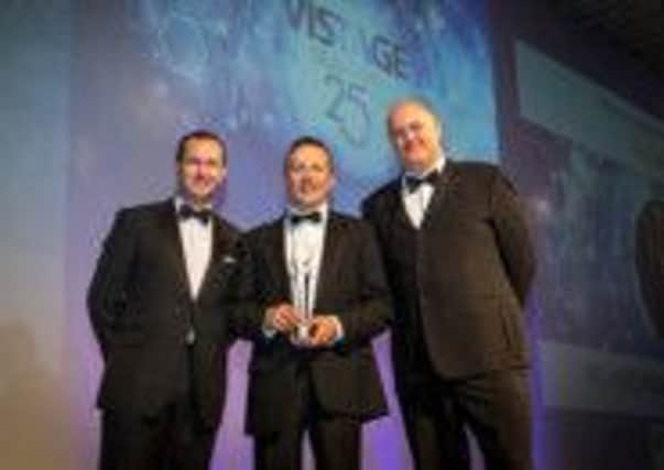 PASSION PRAISED Sean Wood of RBS Corporate Banking and Sliderobes managing director Richard McMullan with awards host Dara O'Briain.