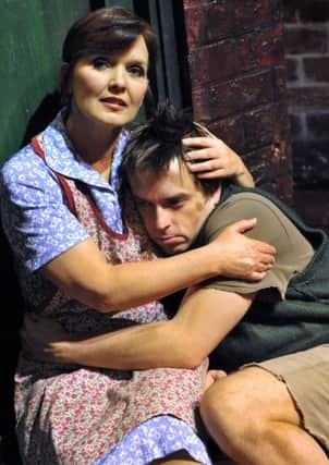MOTHER'S TURMOIL Maureen Nolan as Mrs Johnstone and Sean Jones as Mickey in Blood Brothers.