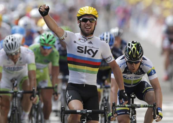 Mark Cavendish crosses the finish line to win the second stage of the 2012 Tour de France
