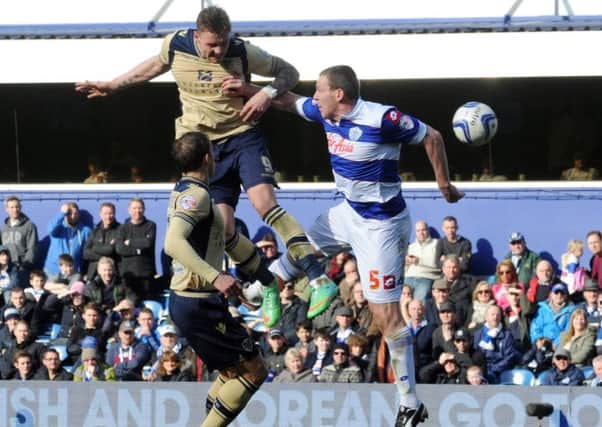 Connor Wickham gets a header in during his debut for Leeds United at QPR. Picture: Simon Hulme