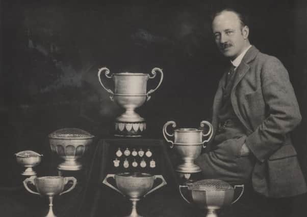 ANGLING STAR Mr Hirst with his angling trophies.
