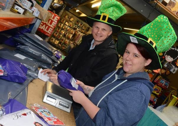 HELPING HAND Jonathan Lodge of Jokingaround Fancy Dress with work experience student Jody Whitehead. (d603a409)