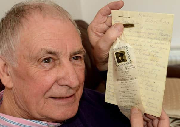 FAMILY HISTORY Norman Hanson with his mother's letter from the trenches and the silk bookmark honouring Lcpl George William Terry. (d610d410)