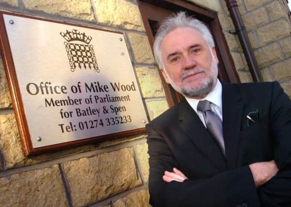 MP Mike Wood next to his plaque outside his office on Cross Crown Street, Cleckheaton. (d15091101)