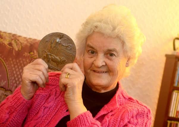 FALLEN SOLDIER Marlene Sunter with the WW1 death penny awarded to her uncle Lindley Thompson Wilson. (D541A404)