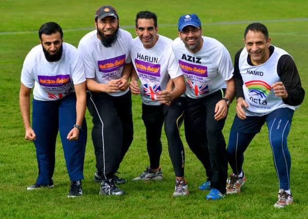 ON TRACK  From left, Elyas Patel, Imran Patel, Harun Umarji, Aziz Patel and Hamid Patel are five of the six runners. Ismail Patel, 26, is also running.