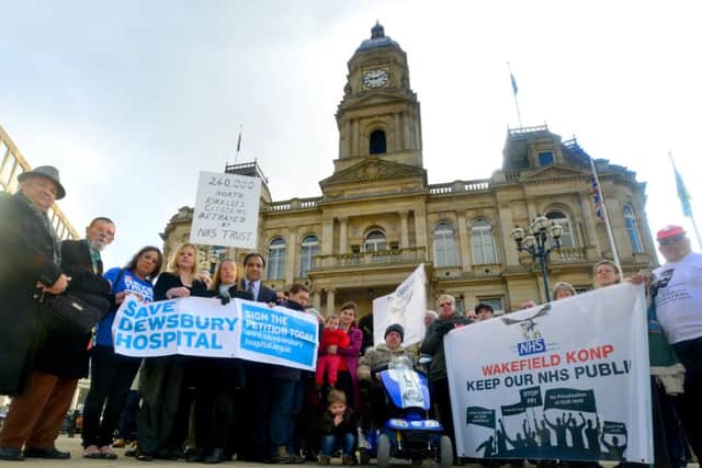 HOSPITAL CUTS Around 50 people gathered in front of the town hall.