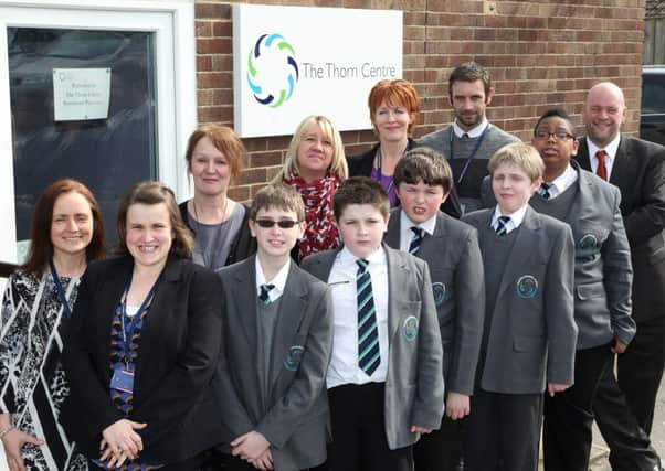 SCHOOL FAMILY Teachers and pupils outside The Thorn Centre.