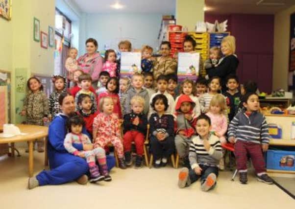 Fredi Kilgallon and his friends at The Hollytree Nursery wearing onesies.