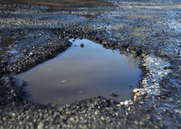 ROAD REPAIRS Labour plan to lobby for more cash to repair roads in Kirklees if they win Mays election.