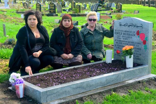 CRUEL VANDALISM Taz and Shameem Hussain with Christine Leeman from the New Friends of Dewsbury Cemetery. (D525B414)