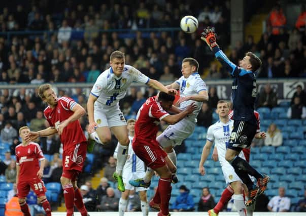 Matt Smith has a header saved against Nottingham Forest. Picture: Simon Hulme