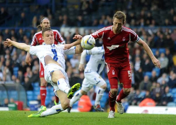 Matt Smith gets in a shot under pressure from Danny Collins during Leeds United's latest defeat against Nottingham Forest. Picture: Simon Hulme