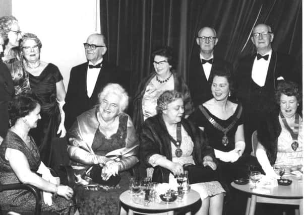 BLACK TIE All dressed up as people used to be when they dined out on special occasions are members and guests of the Dewsbury Soroptimist Club who attended the club's 20th birthday party dinner at the Marmaville Club in 1962. Pictured second from the right, front row, is Mrs Joan Cave, a former president.