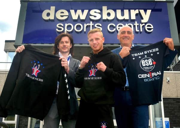 Boxer Gary Sykes with Ian Wardle from Dewsbury Sport Centre and Mick Keith from ESE. (D512G419)