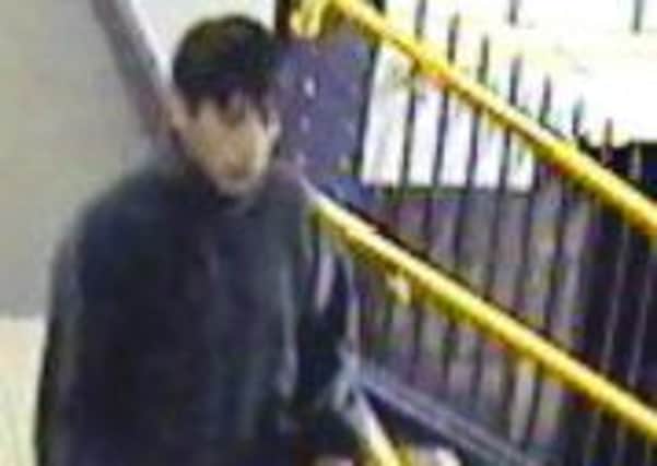 Police are asking for the public's help to trace this man seen waving a knife about at Dewsbury railway station.
