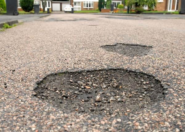 POTHOLE ALLIE .... Rothbury Ave Jarrow has 92 potholes in the road