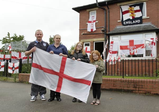 Stuart Gledhill decorated his house in England flags, with Carla, Lilly-Mae and Sian Louise.