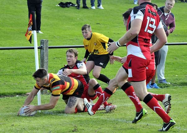 Ross Roebuck crossed for a brace of tries but was unable to prevent Shaw Cross Sharks being edged out by Myton Warriors.