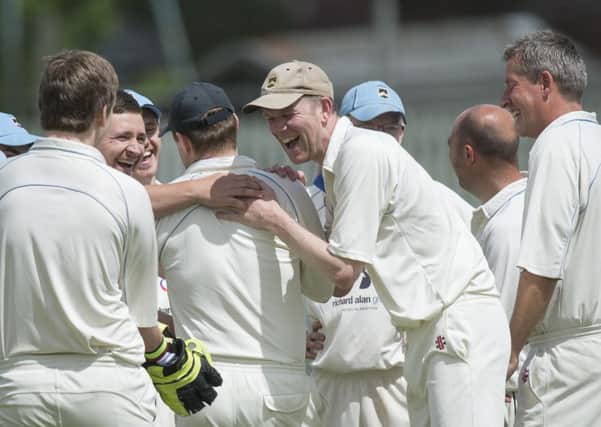 Liversedge players celebrate claiming a wicket in their victory over Wakefield St Michaels, which sees them up to third place in the Central Yorkshire League Championship.