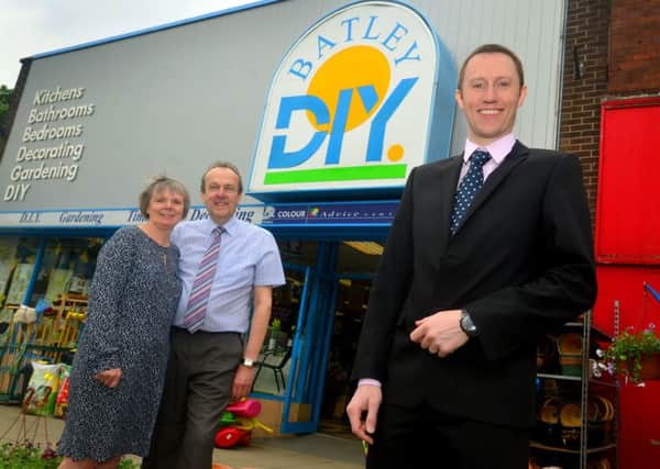Chris and Christine Stainburn are retiring after 29 years from Batley DIY centre, with James Elliot.