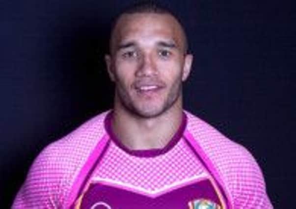 Miles Greenwood in the pink Bulldogs shirt for breast cancer