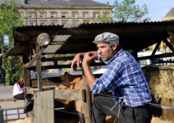 Part of Huddersfield town centre has been transformed into a working French farm, complete with animals, to celebrate the Tour de France.