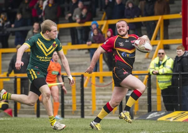 Aaron Brown on his way to scoring a try against West Hull.