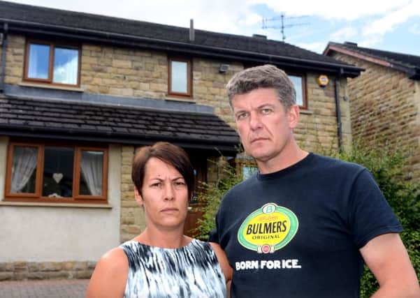 Paul Beaumont and his wife Alison outside their home in Liversedge. (d610b428)