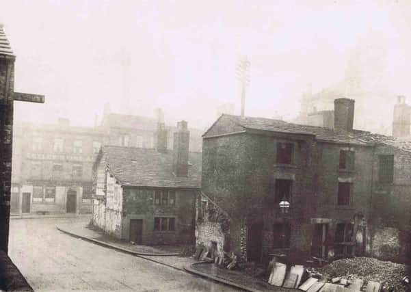 CHANGING TOWN Work begins on the demolition of buildings in Northgate in 1890 to make way for the London and Yorkshire Bank. Picture kindly loaned by Stuart Hartley.