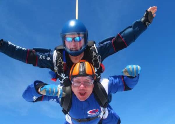 Gary Roper and  instructor Walzer Wes jump 15,000ft out of a plane for charity.