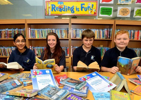 Bruntcliffe school's accelerated reading programme has seen pupils read 66,099,067 words and 4,083 books. The reading 'Millionaires' are Kibla Zahoor, Morgan Bennett, Ben Viets and Luke Crossland. (D552B428)