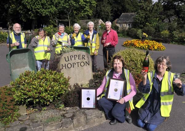 Hopton in Bloom volunteers in 2012 celebrating with champagne after winning their category at Yorkshire in Bloom and a silver gilt award.