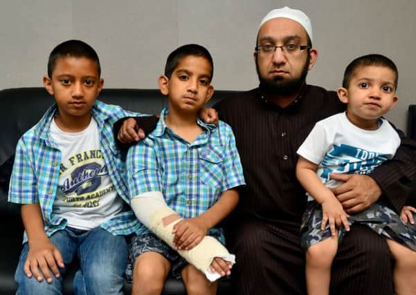 Yusuf Mayet was attacked by a dog, with dad Akil and brothers Umar and Aamir (d522h430).