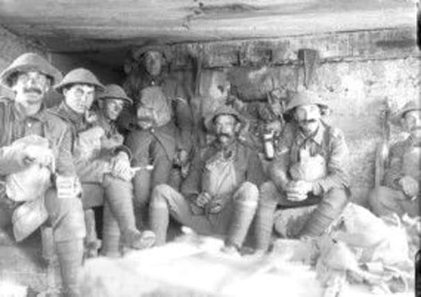 WAR HEROES Men of the West Yorkshire Regiment sitting in a captured German pill box during the Battle of Passchendaele.