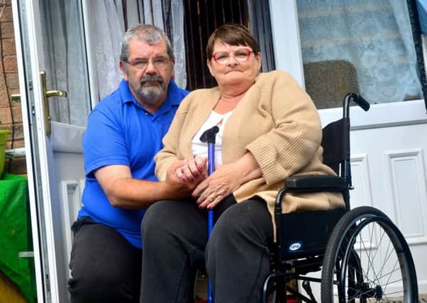Kevin and Ann Gresham outside their specially adapted home.