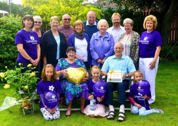 George and Joan Midgley are celebrating their golden wedding anniversary. Instead of receiving gifts they had a fund raising party in aid of charity. (D552E432)