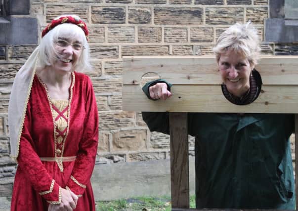 St Marys Medieval Festival. The Vicar and Church Warden in the stocks.