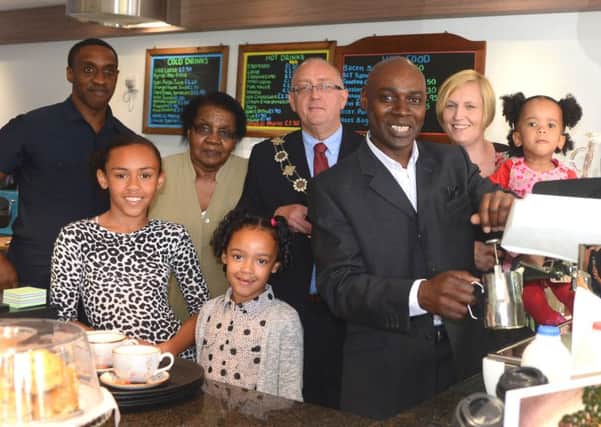 COFFEE SHOP Owner Neville Morris with his family and deputy Mayor Paul Kane (d602b435).