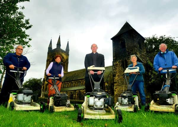 MOW POWER: The Rev Hugh Baker with some of the volunteers who help keep St Marys Church spick and span. (d511b434(2))