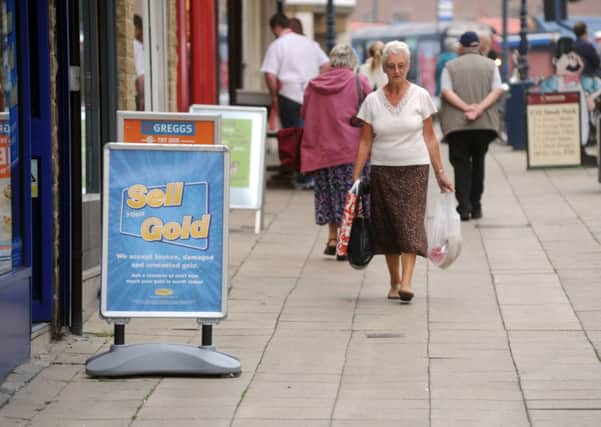 The council has said A-boards are a risk  but will let traders keep them if they pay.