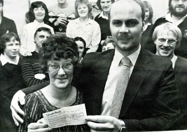 CHARITY CHAMPS Perserverance landlady Margaret Ward hads over a cheque to David Turner, administrator at Staincliffe Children's Hospital.