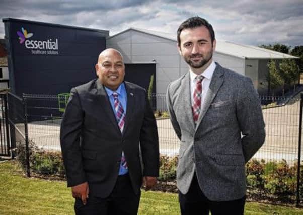 Development officer Ramesh Bains and Essential Healthcare Solution managing director Thomas Owens.